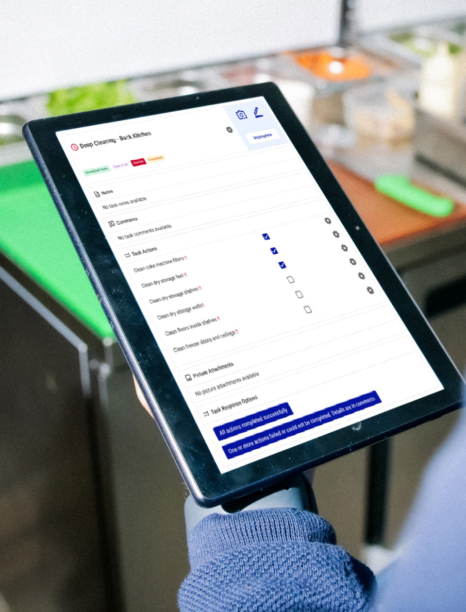 Person holding tablet looking at food stock